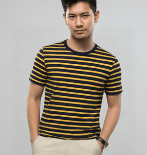A Man Wearing a Navy And Mustard Striped Organic Cotton T-shirt, Featuring Bold Yellow And Black Stripes.