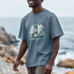 A Man Wearing An Oversized Organic T-shirt Showcasing a Shining Lighthouse Design.