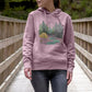 A woman wearing a pink hoodie with a forest design, representing the New Season Women's Pullover Organic Hoodie.