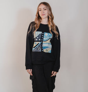 Black oversized sweatshirt featuring an abstract design