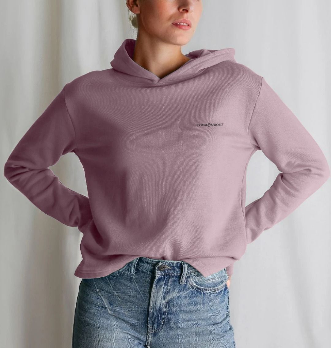 Women's relaxed fit hoodie in dusty pink, labeled "stronger than ever," showcasing a comfortable and stylish design
